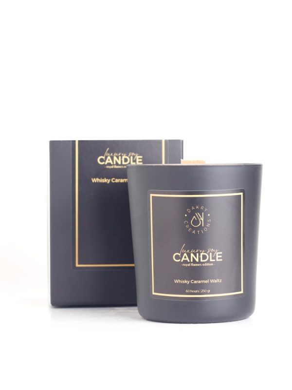 Whiskey caramel waltz scented soy candle in a glass jar