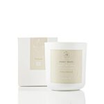 Honey and fresh cotton scented soy candle in a glass jar