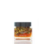 Greek orange blossom honey jar with whole Aegina pistachios