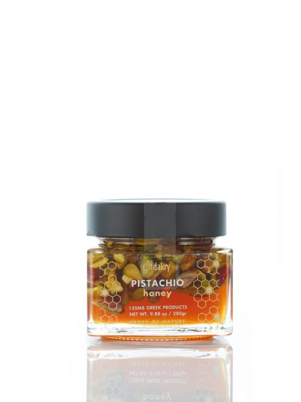 Greek orange blossom honey jar with whole Aegina pistachios