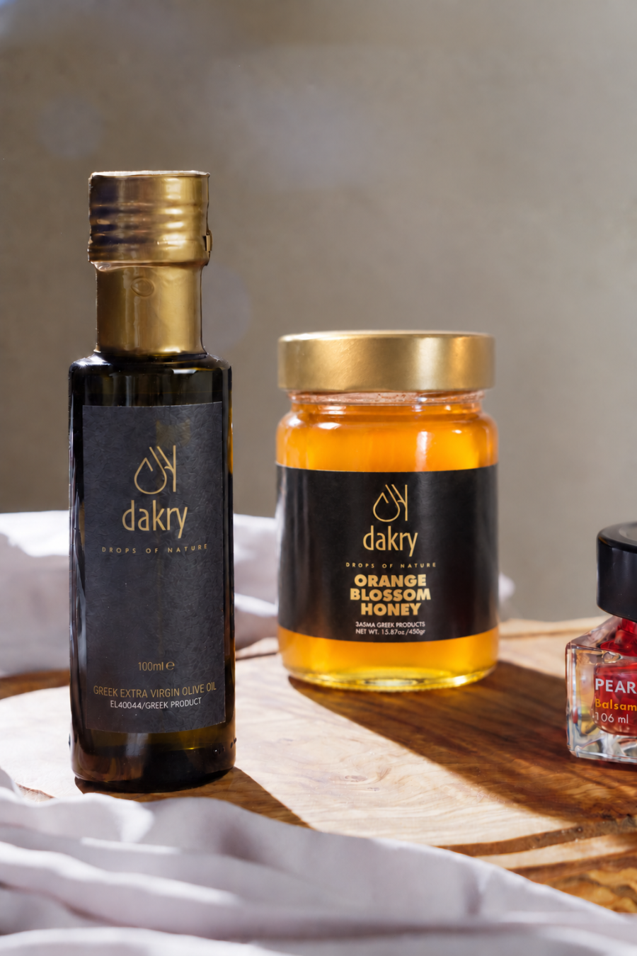 Sunny Tastes gift box with Greek olive oil, orange blossom honey and pomegranate balsamic pearls by Dakry Olive