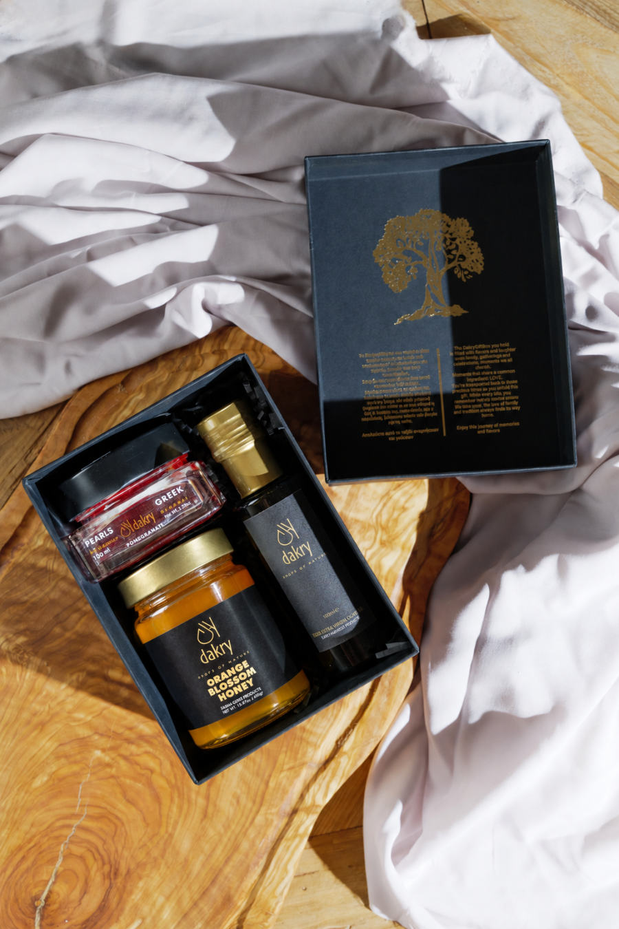 Sunny Tastes gift box with Greek olive oil, orange blossom honey and pomegranate balsamic pearls by Dakry Olive